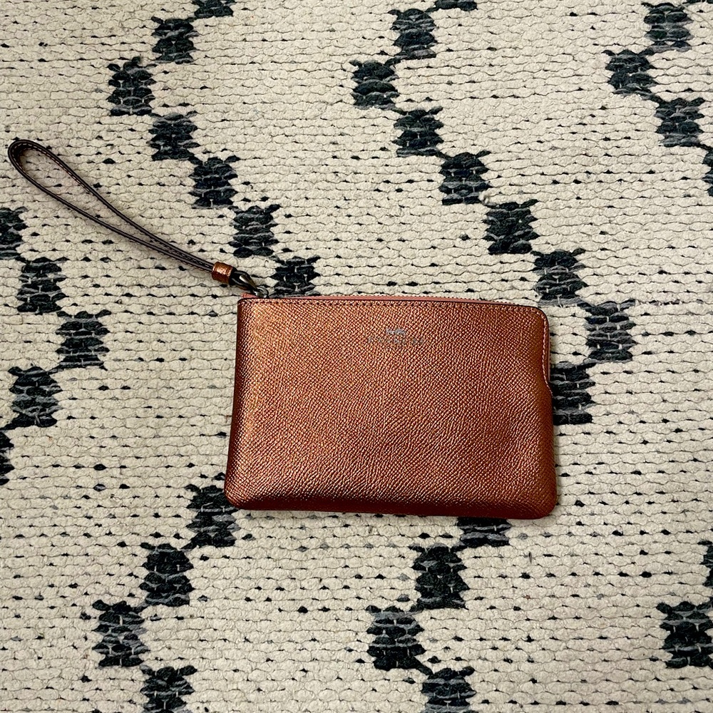 Coach Metallic Dark Blush Leather Wristlet.